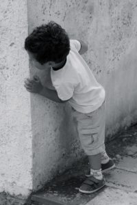 Child playing hide & seek